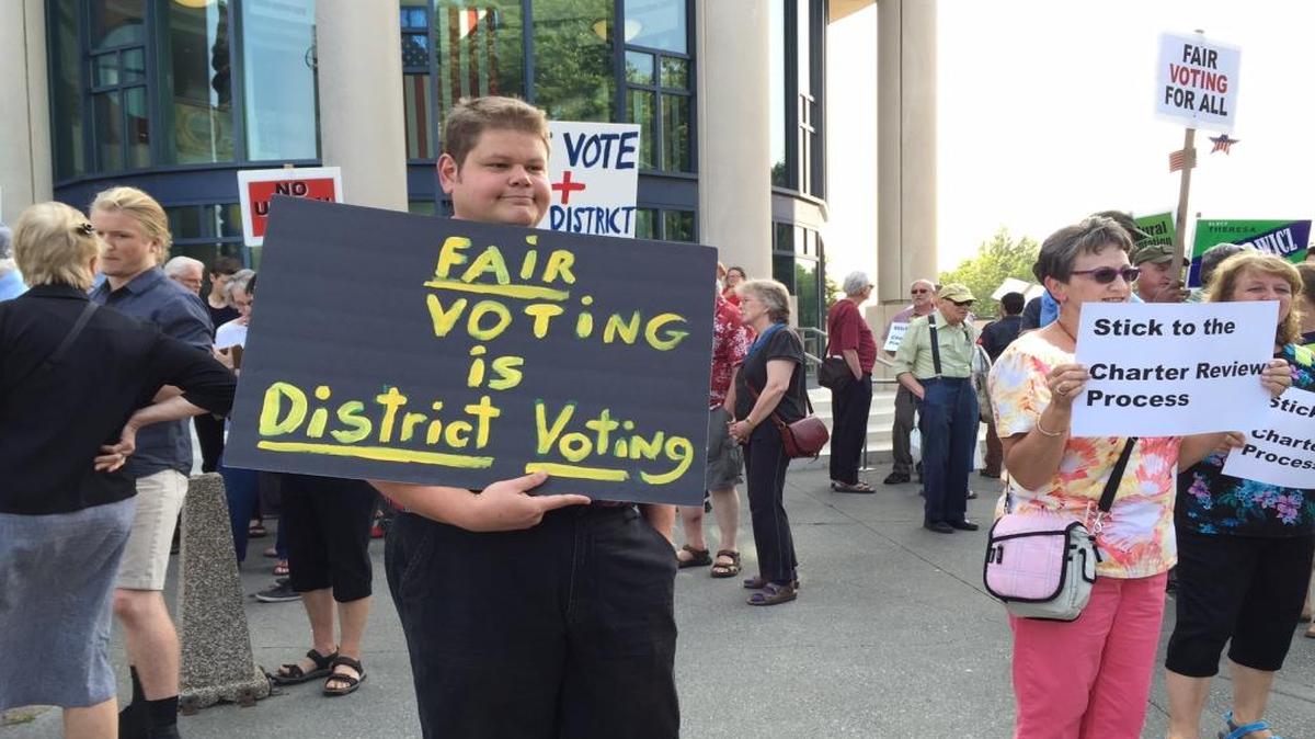 
Supporters of district-only voting rally July 7 outside Whatcom County Courthouse in Bellingham before a County Council meeting.
