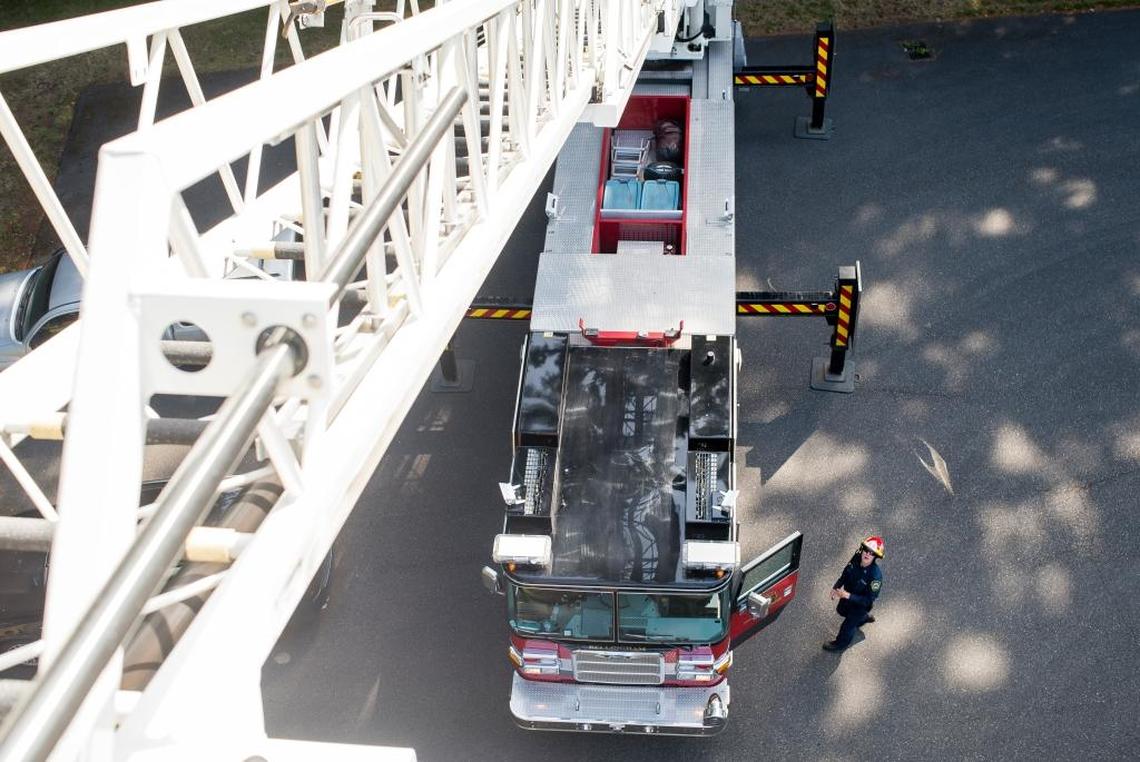 Bellingham Fire Department Capt. Robert Gray looks up at the ladder on a ladder truck during a routine check of equipment and apparatuses on Saturday, July 1, at Bellingham Fire Department Station 5. When not responding to fire and aid calls the Bellingham Fire Department conducts training on weekdays and inventory and equipment maintenance on Saturdays.