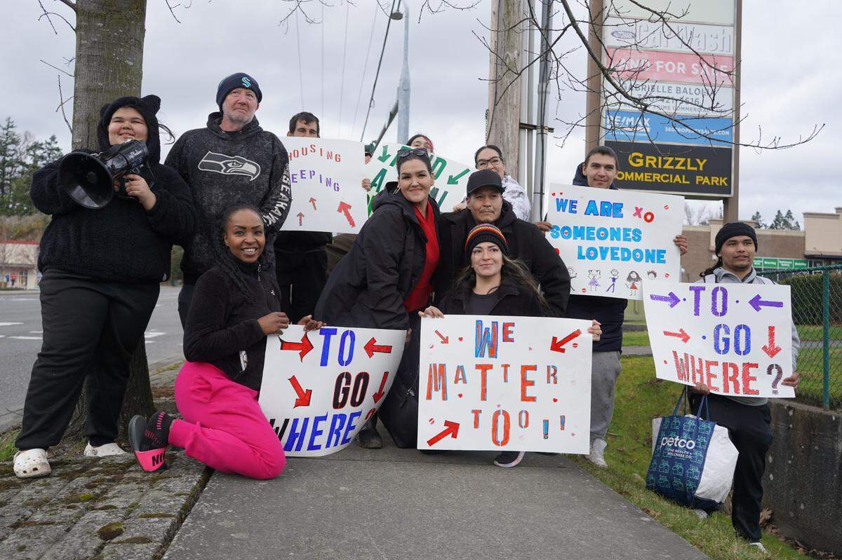About 15 people gathered on March 9, 2024, to protest the impending clearing of the encampment behind Walmart in Bellingham, Wash. Protesters said they want more housing and services for the unhoused.