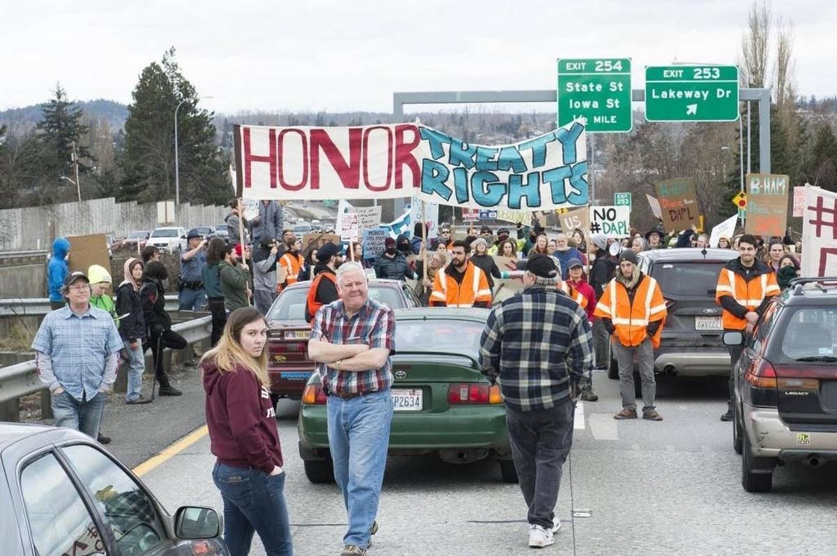 Protesters block northbound Interstate 5 at Lakeway Drive on Saturday, Feb. 11, in Bellingham.