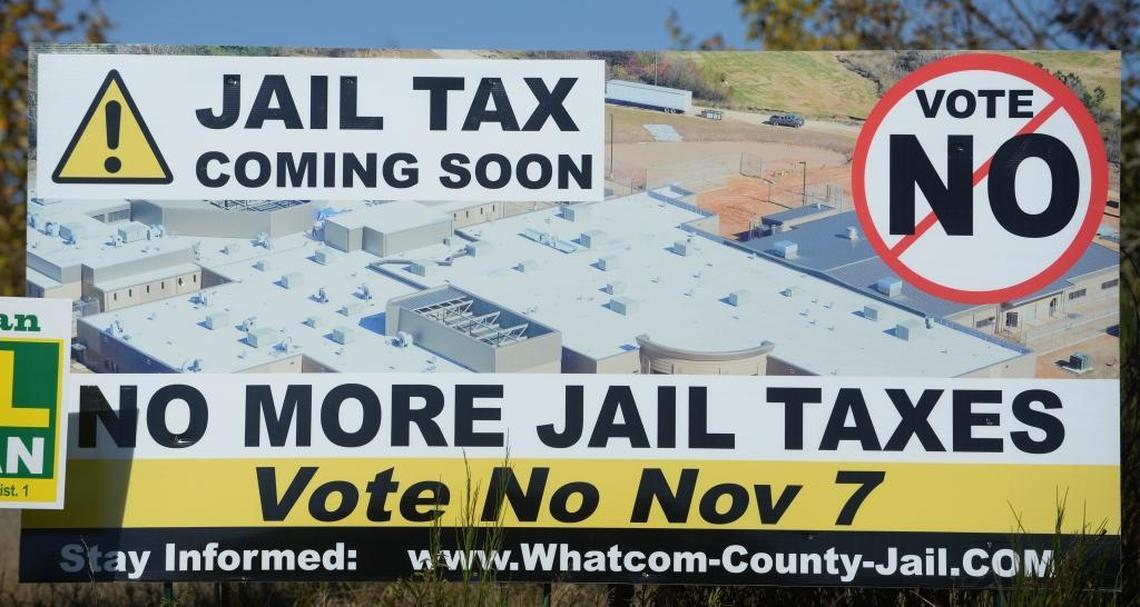 Sign overlooking Interstate 5 near Sunset Drive in Bellingham against building a new Whatcom County Jail.