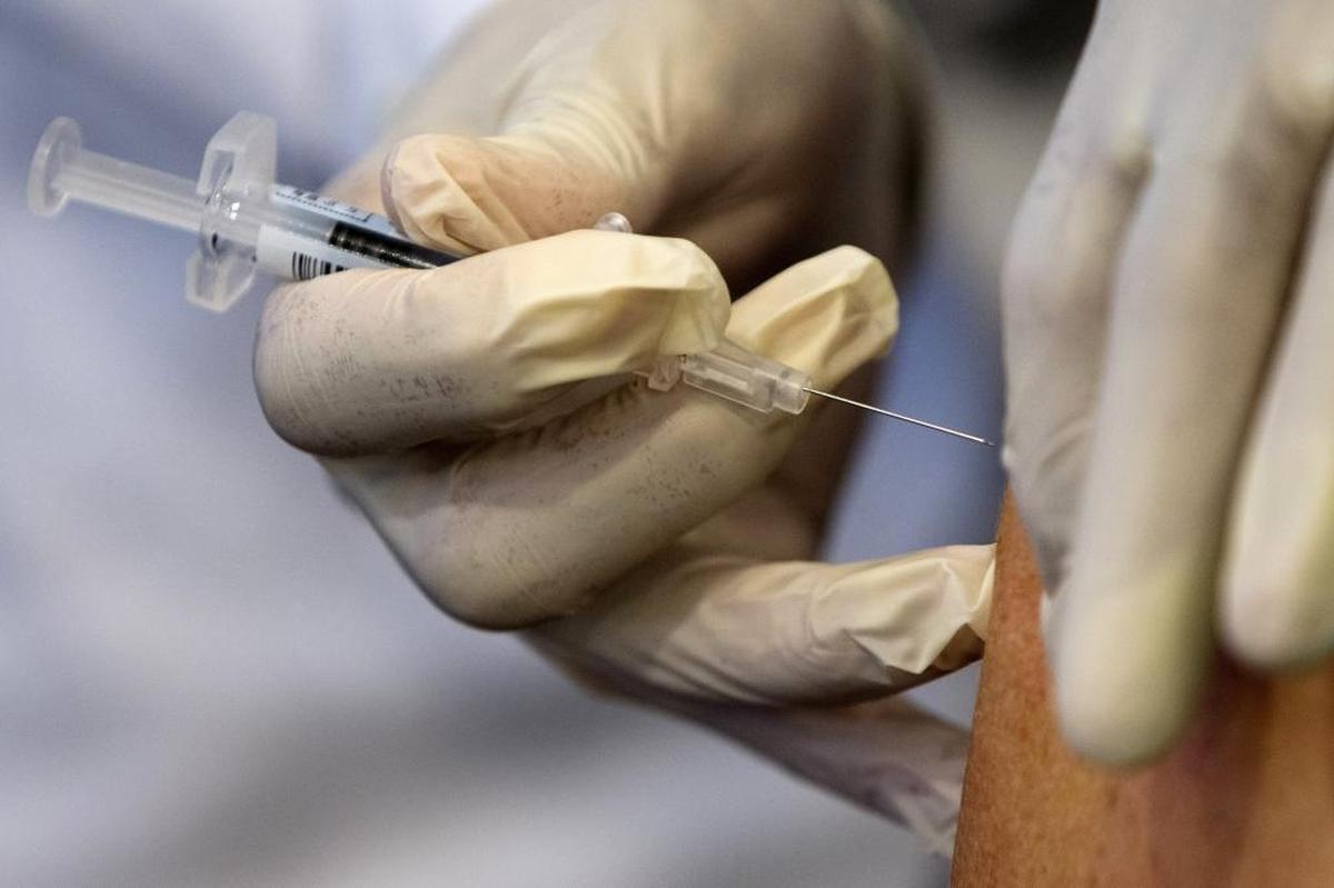 In this file photo, a nurse gives administers a flu vaccine shot in Washington. Health officials say the annual flu vaccination is the best method of prevention against illness.