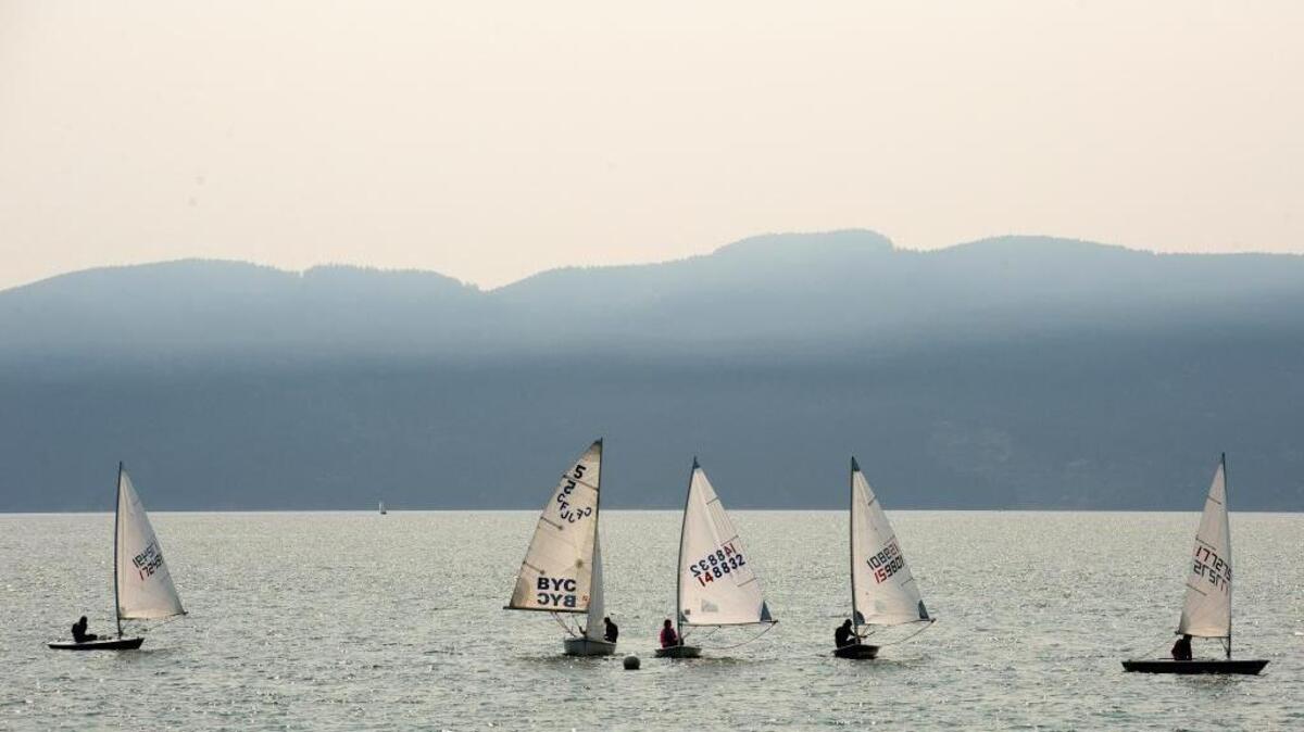 Sailboats make their way from Zuanich Point Park Tuesday in Bellingham. The smokey haze is caused by wildfires in British Columbia, as air quality conditions in Whatcom County range from “Good” to “Unhealthy for Sensitive Group.”