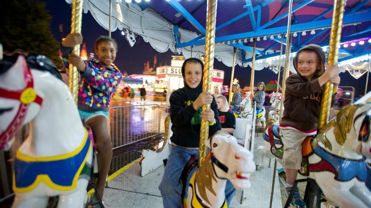 Children ride the carousel at the 2013 Northwest Washington Fair in Lynden.