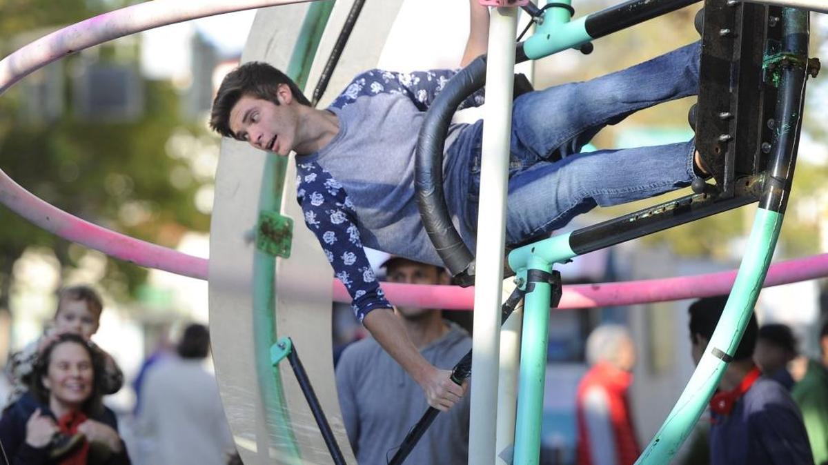 Dylan DeVries, 18, of Bellingham enjoys a ride on the Orbitron during the first Commercial Street Night Market in Bellingham on Sept. 4, 2015. The event, which won two awards in the first “Kapow!” competition, drew big crowds during its early fall run. A second competition is set for 2016.