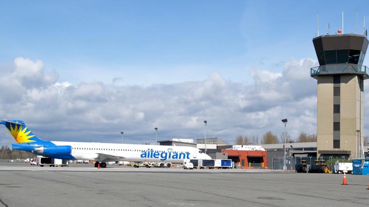 
An Allegiant flight waits to board passengers at Bellingham International Airport. Comvest Partners, which purchased a majority stake of Haggen in February 2011 and is now seeking Chapter 11 bankruptcy for the grocery chain, helped Allegiant Travel Company grow from a small private airline in 2005 to a public company with bases in airport bases in Phoenix, Bellingham and Florida before it sold its interest in May 2010. Allegiant stock shares rose from around $30 in 2007 to $232.87 in August 2015. 
