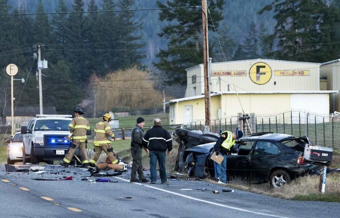 Emergency responders survey the scene of a deadly crash on Mount Baker Highway near the Mission Road intersection, Jan. 28, 2016 near Bellingham.