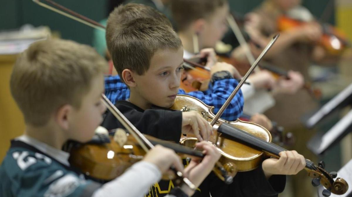 
Connor Brueske, 10, left and Grady Korby, 11, perform at the fifth grade violin concert at Silver Beach Elementary on Nov. 25, 2014. The concert was the culmination of a 10-week pilot violin class. The Bellingham School District is adding staff this school year to offer string instruction to students.
