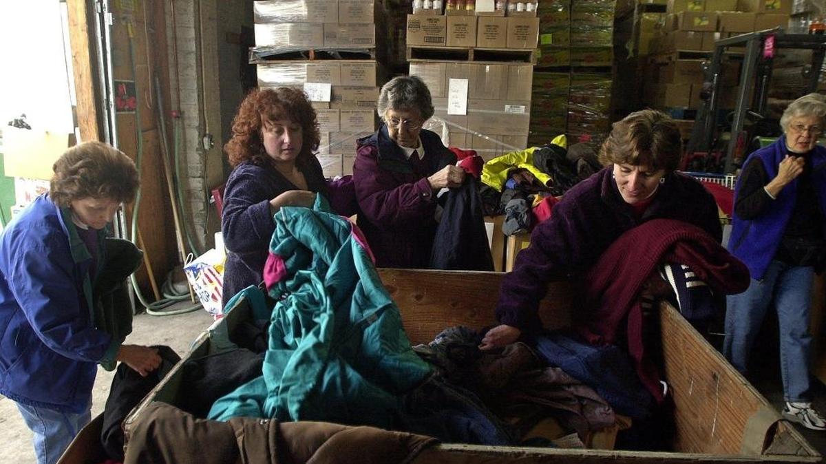 
Volunteers sort coats donated for the Interfaith Coalition coat drive in 2001. This year donations of adult or children’s warm outerwear, new or gently used, are being taken at Banner Bank branches and local churches.
