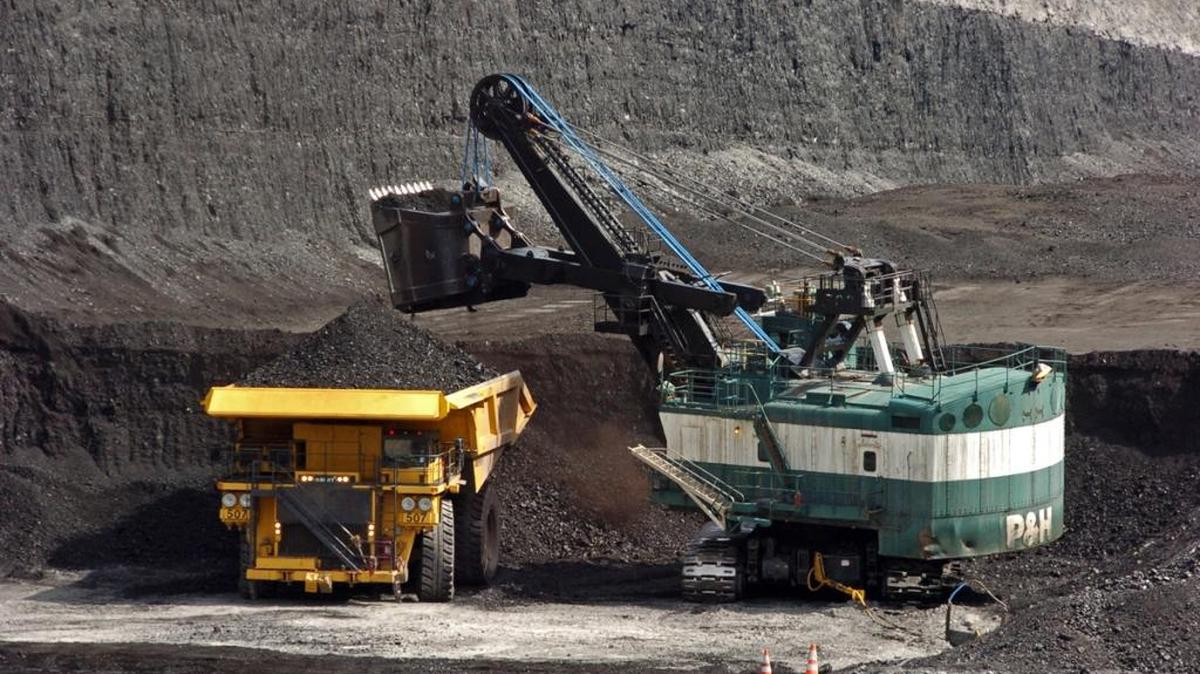 FILE - In this April 4, 2013 file photo, a mechanized shovel loads coal onto a haul truck at the Cloud Peak Energy's Spring Creek mine near Decker, Mont.
