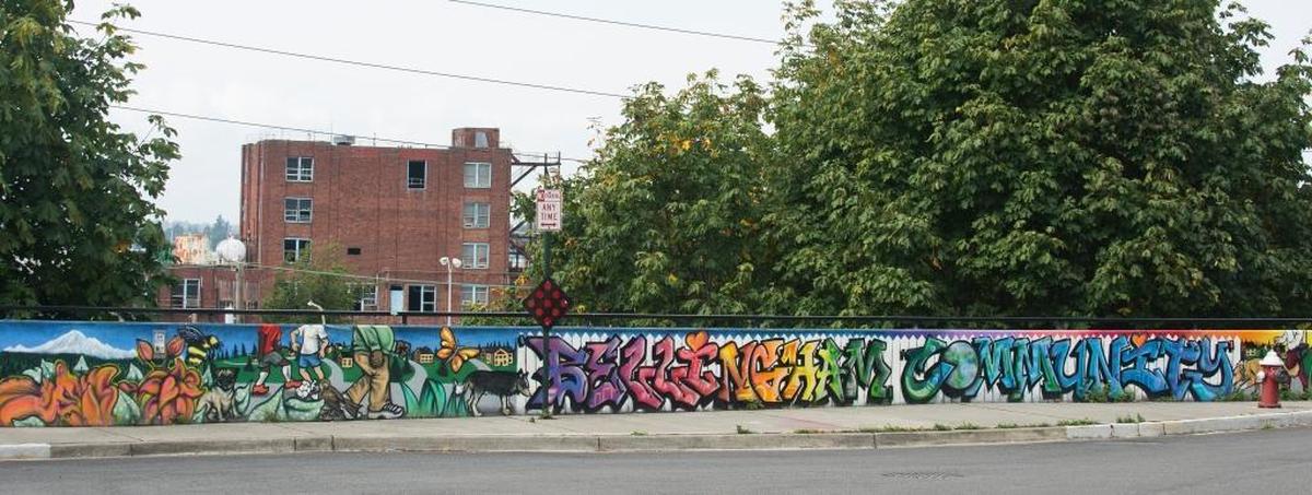 The City of Bellingham and Morse Square Condominiums funded the Community Mural by Shawn Cass.