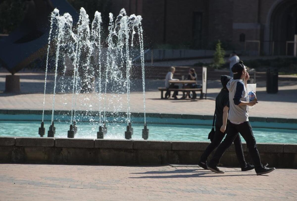 People walk through Red Square on Thursday, Sept. 18, 2014 at Western Washington University. Western was in the top 10 in a list of largest Whatcom employers.