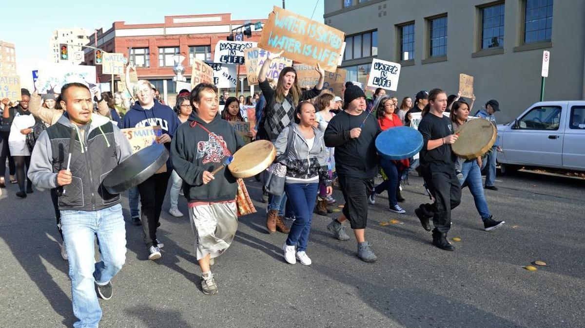 Protesters march on Bay Street to the Whatcom Democrats office in downtown Bellingham Thursday afternoon, Nov. 3, 2016, to demand that Gov. Jay Inslee take action regarding the Dakota Access pipeline. Inslee had just left the building.