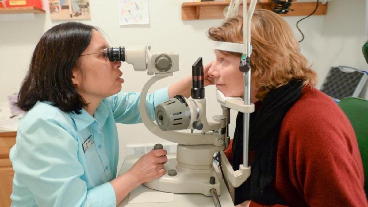 Optometrist Darlene Anker gives Barb Roy an eye exam at the Frank Haskell Lions Eye Clinic at the Lighthouse Mission drop-in center Thursday, Feb. 18, 2016, in Bellingham. Roy was the 1,000th patient the clinic has seen since it opened in 2012.