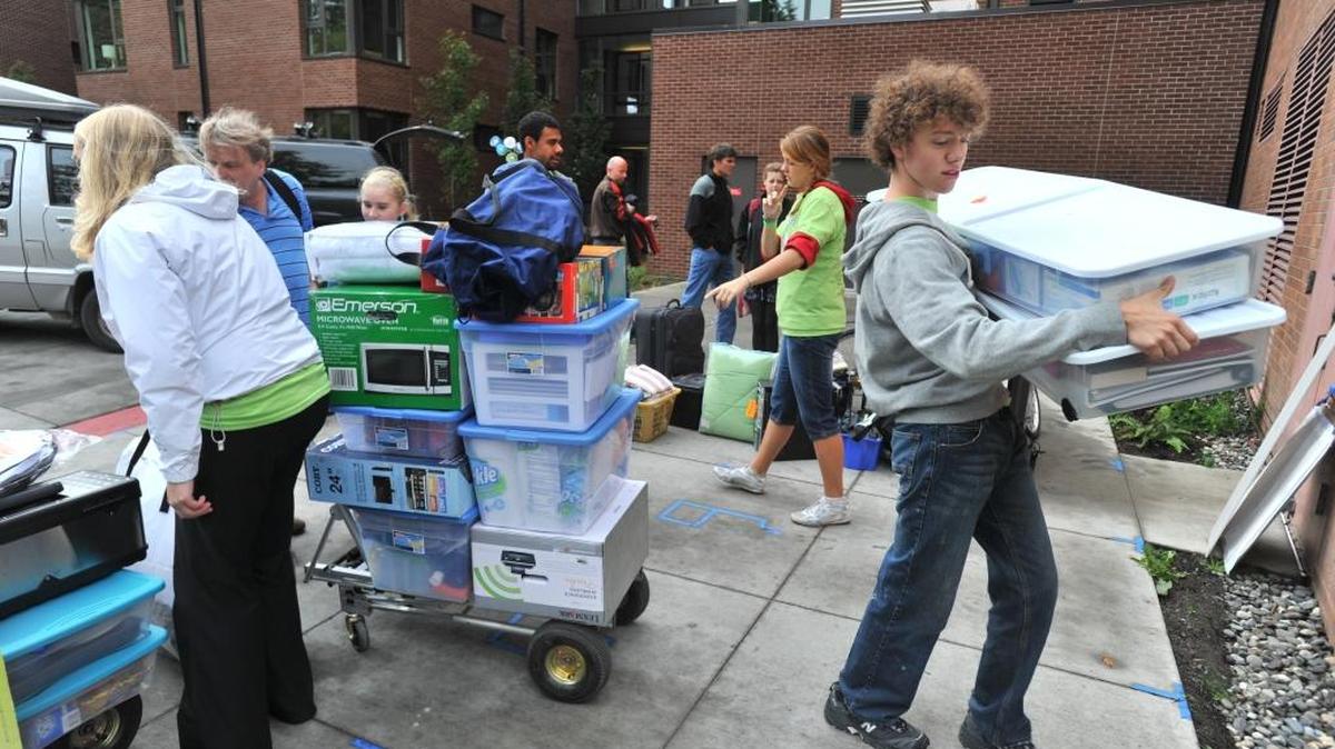 
Incoming freshmen students and their parents get help as they move into Buchanan Towers at Western Washington University on Sep. 17, 2011, in Bellingham.
