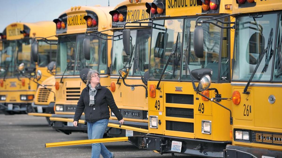 
Ferndale School District bus driver Sue Mittelstaedt checks her bus lights before leaving the transportation center to pick up kids Tuesday afternoon, Jan. 14, 2014.
