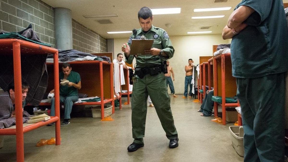 A deputy takes a head count at night on Thursday, July 30, 2015, at Whatcom County Jail in Bellingham. The city’s police department is now restricted from booking people into the jail on certain charges if the population gets too high.