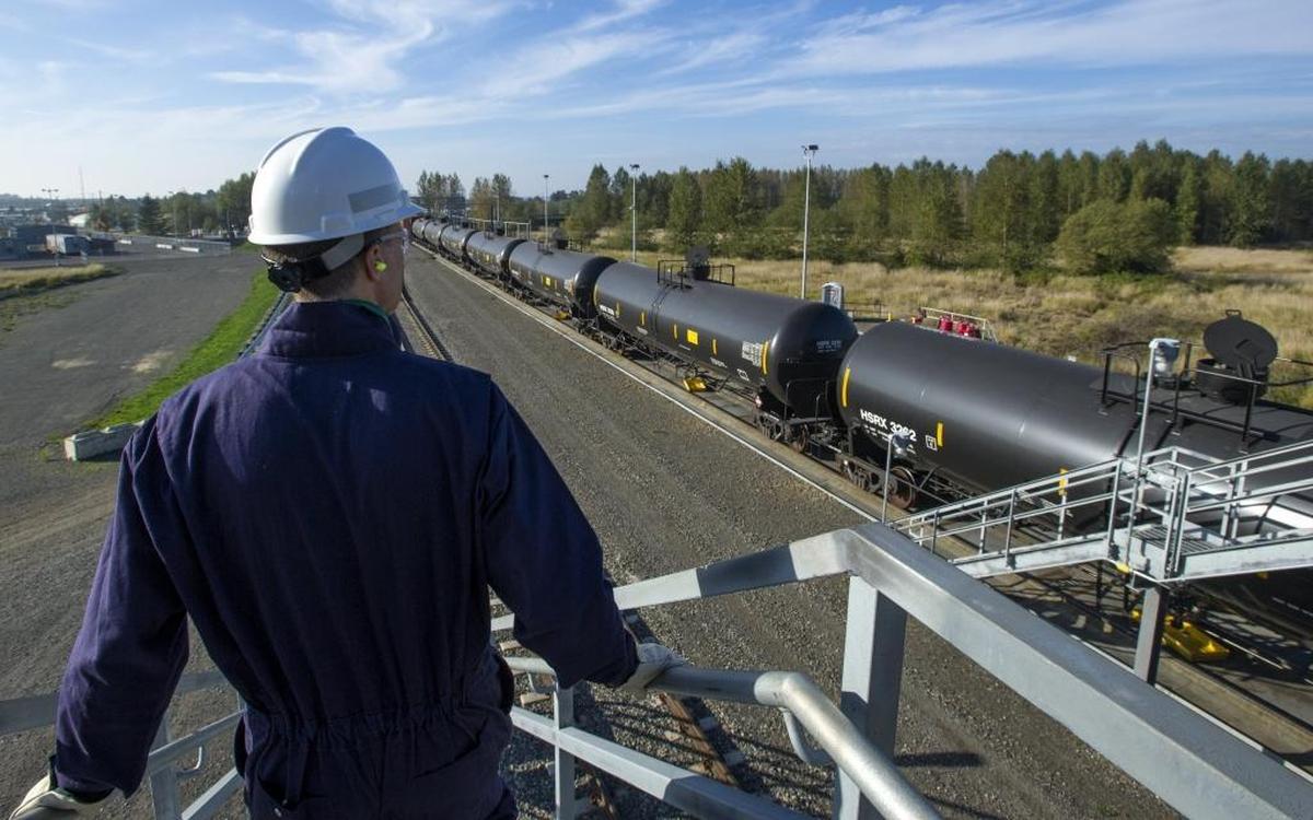 BP Cherry Point spokesman Scott Dean walks down the stairs of a bridge over the new rail loop in 2014. The refinery opened the loop in 2014 to bring more crude oil from other U.S. states. Now, the future of development in the Cherry Point industrial zone is one of the key issues in this year’s election race for Whatcom County executive.