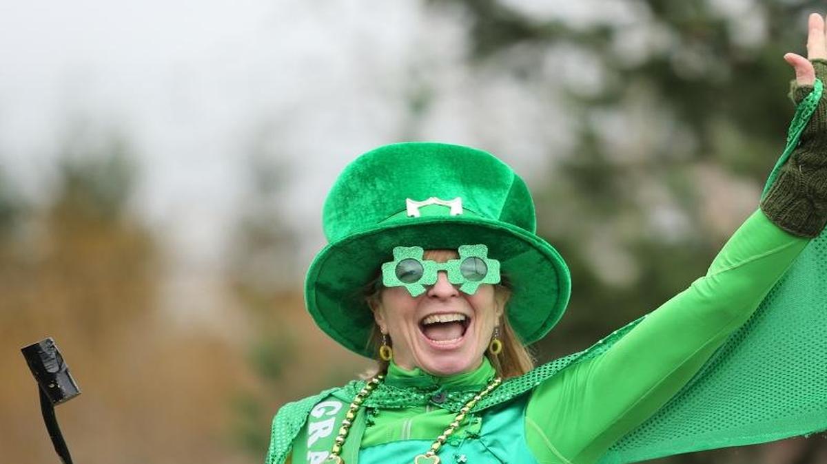 St. Patrick’s Day Parade grand marshal Tammy Bennett waves to the crowd March 16, 2013, in Bellingham.