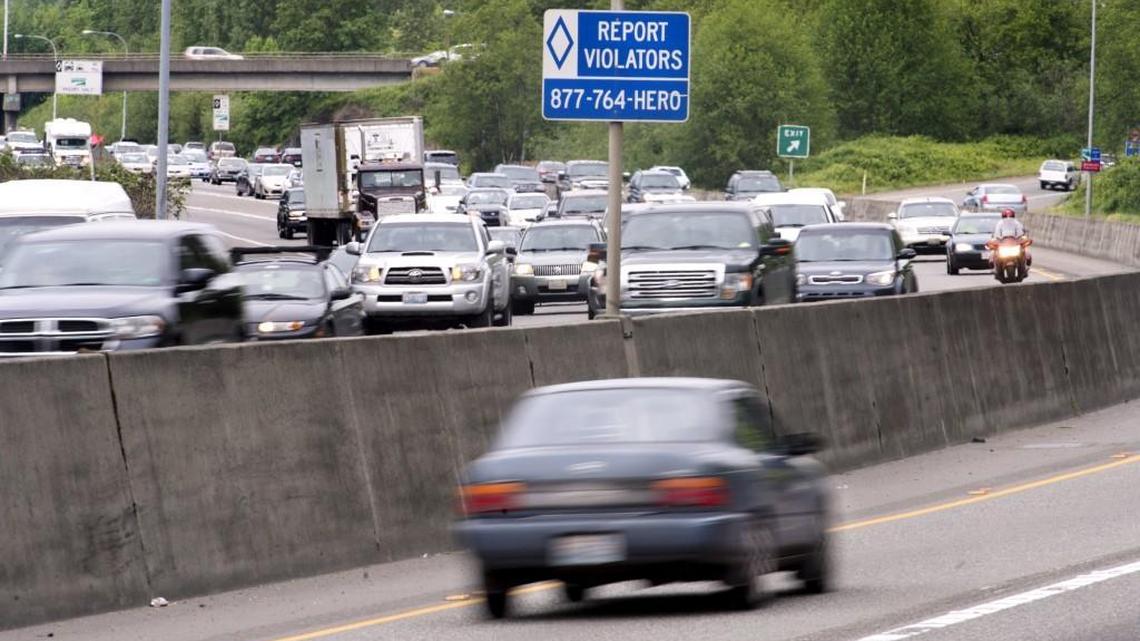 Washington Administrative Code states that the HOV lane is for the use of “private motor vehicles with the number of occupants specified on signs.” There is no mention of occupants being at least a certain age or holding a driver license.