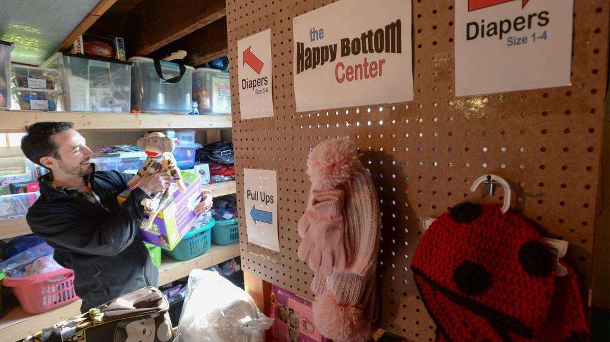 Ray Deck III, founding director of Skookum Kids, looks at some of the donated goods for foster children in the basement of the children’s temporary shelter in Bellingham on Friday Feb. 12, 2016. Skookum Kids will be offering the supplies twice a month for people who are caring for foster children.