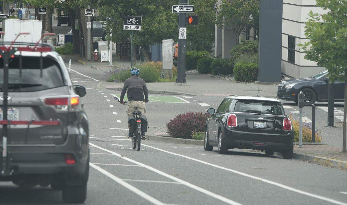 A cyclist bikes down the newly installed bike lane on Holly Street in downtown Bellingham.