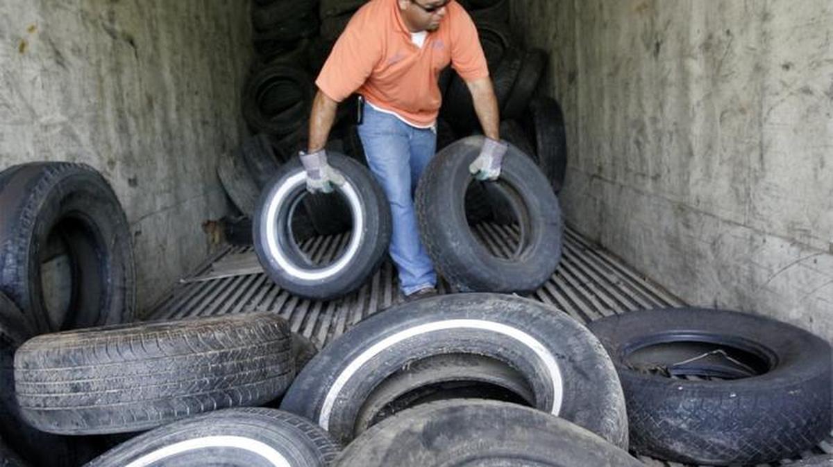 A man loads a truck with old tires for recycling in California in 2006. Whatcom County residents can drop off up to 15 car or small-truck tires for free at the Birch Bay Drop Box and Recycling Center at the end of this month and the start of May.