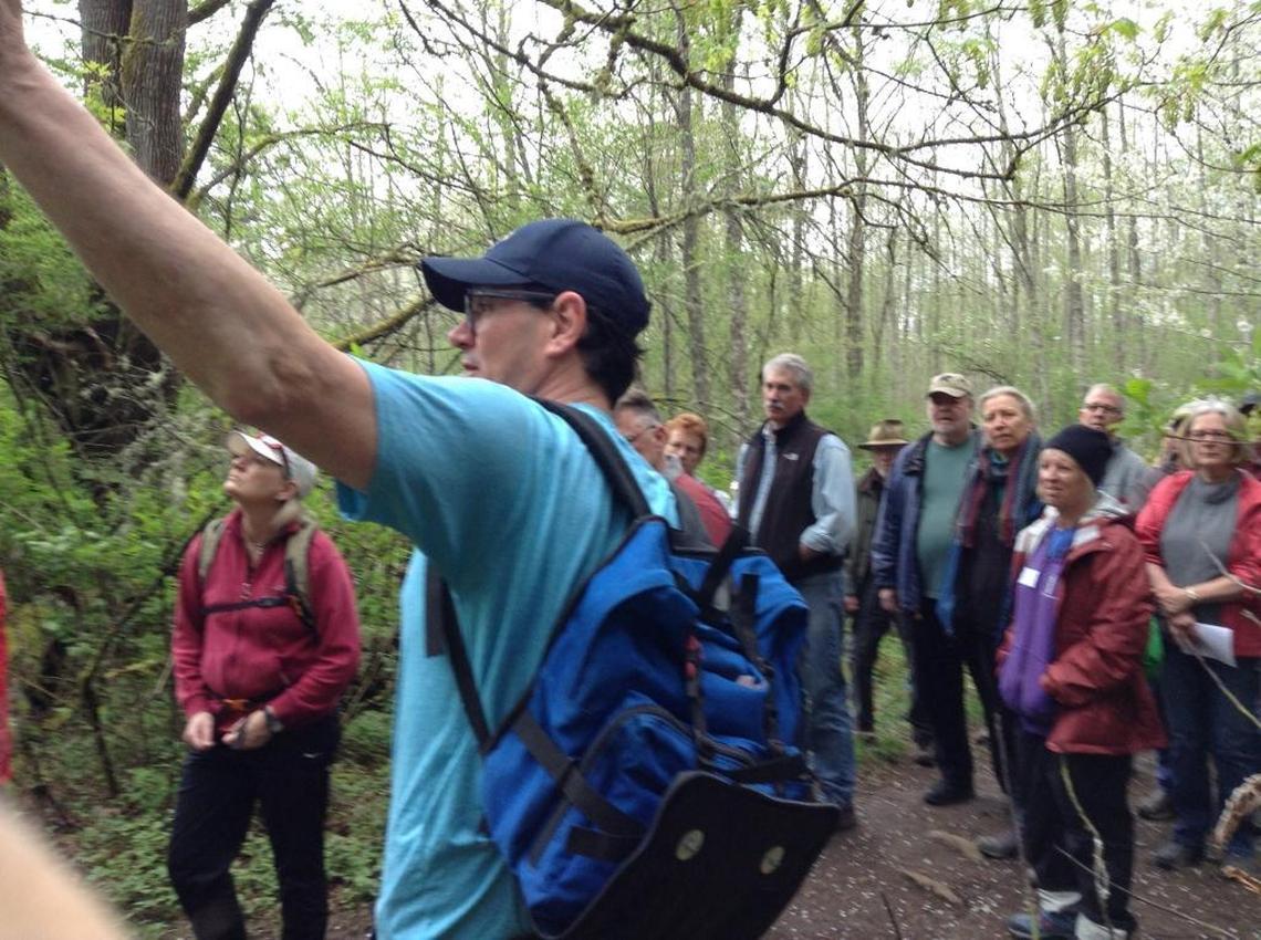 Todd Elsworth, co-executive director of Recreation Northwest, leads a tour in 2017 through the Hundred Acre Wood in the southern part of Fairhaven Park.