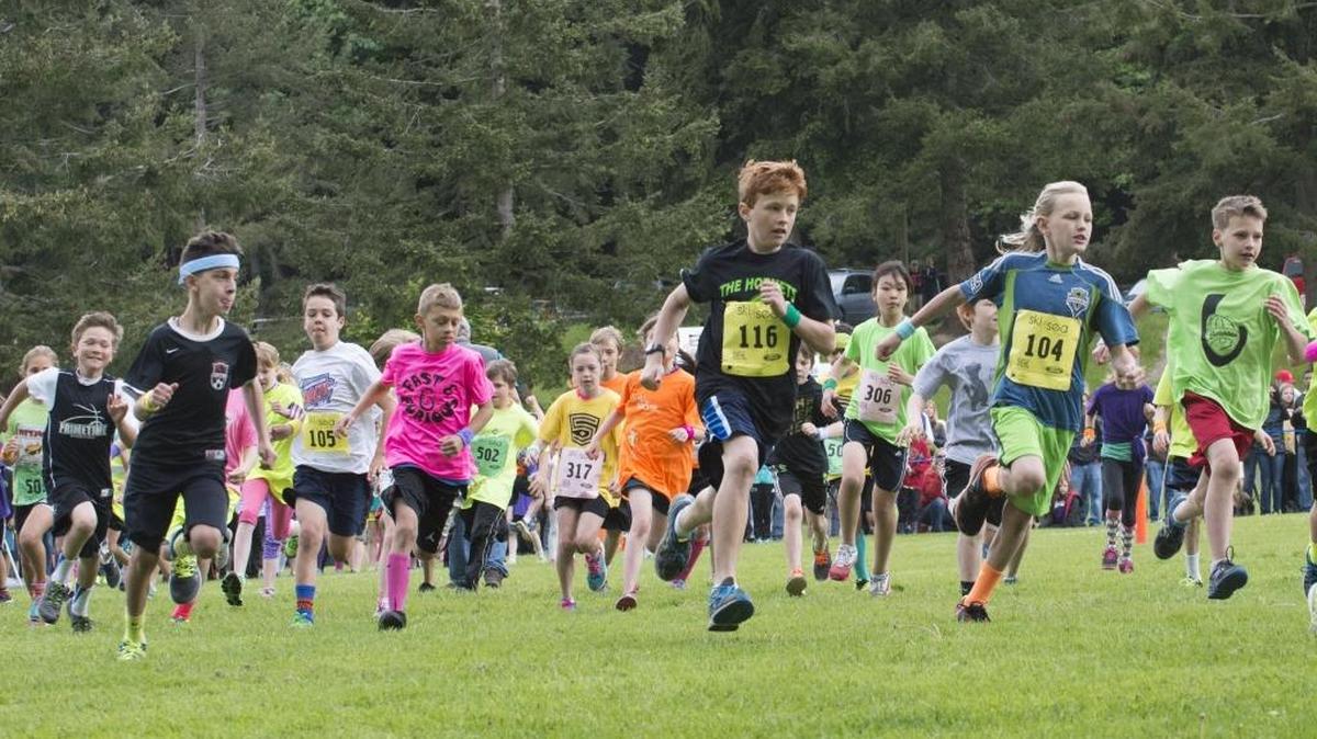 Children take off from the starting line of the 2015 Junior Ski to Sea Race at Lake Padden in Bellingham. The 2016 race will pack much of the park Saturday, May 21.