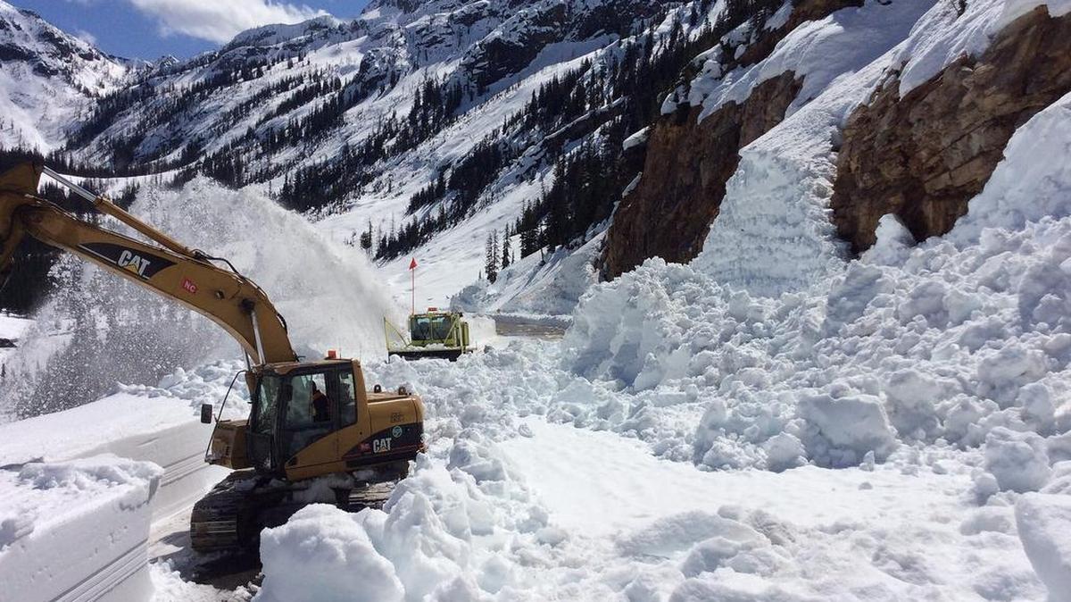 Road crews working for the Washington state Department of Transportation work through an avalanche zone near Liberty Bell Mountain while clearing the North Cascades Highway on Wednesday, April 13, 2016. The snow pack, while abundant, is quickly melting due to high spring temperatures.