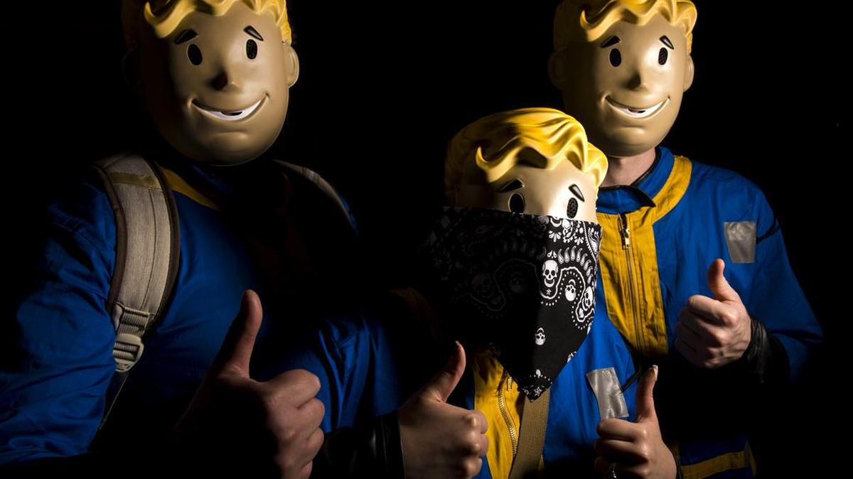 From left, Patrick Munoz, Jade Weidemann and Bryan Wilson, dressed as the mascot from the Fallout video game series, are pictured at Bellingham ComiCon on Saturday, Oct. 22, 2016, at the Ferndale Events Center in Ferndale, Wash.