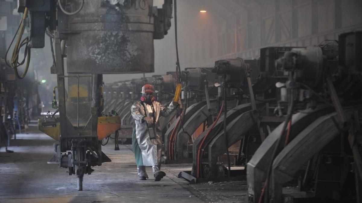 Workers start aluminum smelter pots on potline B at the Alcoa Intalco aluminum smelter west of Ferndale on Feb. 15, 2011.