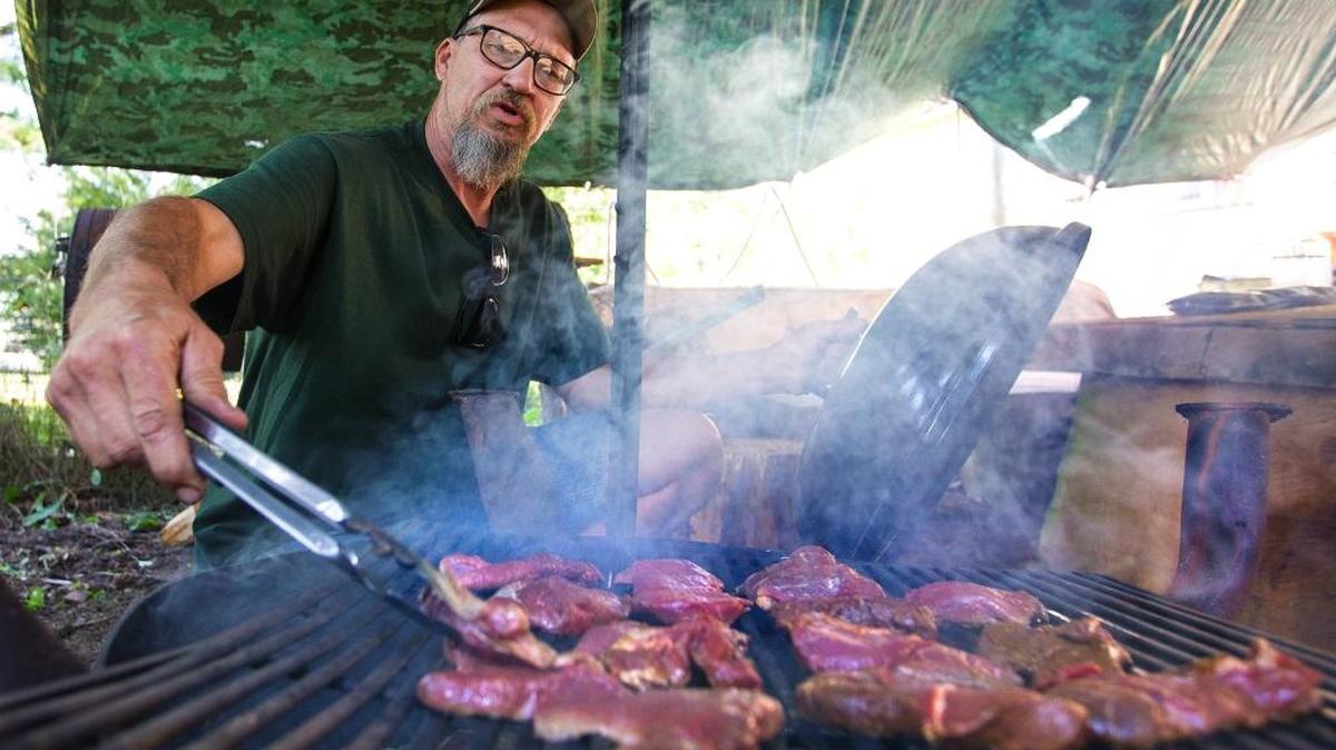 Tim Bento of Lynden grills deer meat he obtained as roadkill along a highway near his home on July 18, 2017. Last July, the Washington Fish and Wildlife Commission changed state code to allow the salvage of elk and deer accidentally killed by vehicles. In the program’s first year of existence, people plucked nearly 1,600 deer and elk off Washington roadways, according to a Washington Department of Fish and Wildlife database of permits required for salvage.
