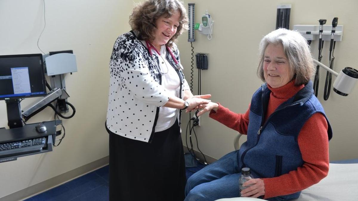 
Medical Director Dr. Barbara Clue visits with patient Catherine Huhndorf at the Interfaith Community Health Center in Bellingham in 2014. Interfaith is expanding in Bellingham and plans to build a new clinic in Ferndale.

