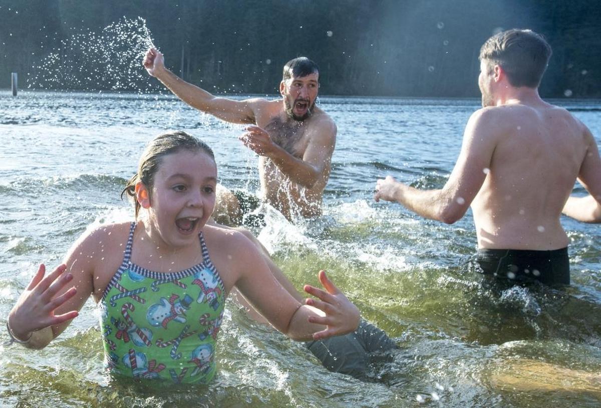 Hundreds of people jump into Lake Padden at the 2014 Padden Polar Dip on Thursday, Jan. 1, in Bellingham.