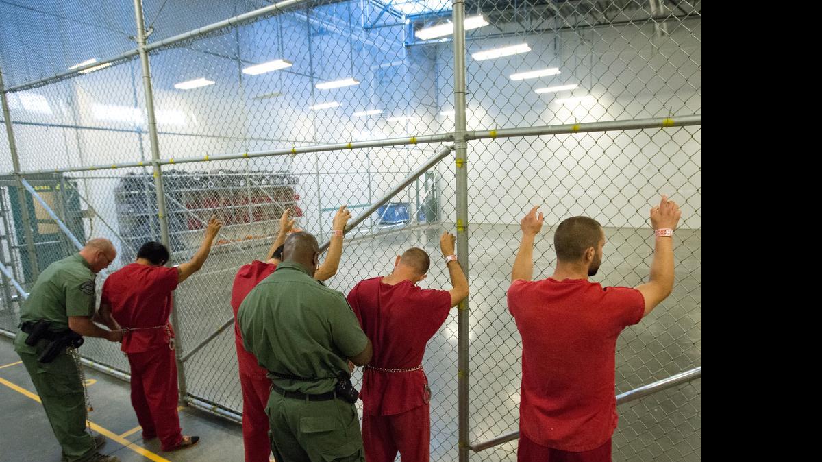 
Deputies prepare minimum-security inmates for transport next to the recreation area at Whatcom County Jail’s Interim Work Center on Tuesday, June 30, in Bellingham. The inmates were taken to Whatcom County Jail to work in the kitchen. The work center was built and is operated with money from a 2004 sales tax increase.
