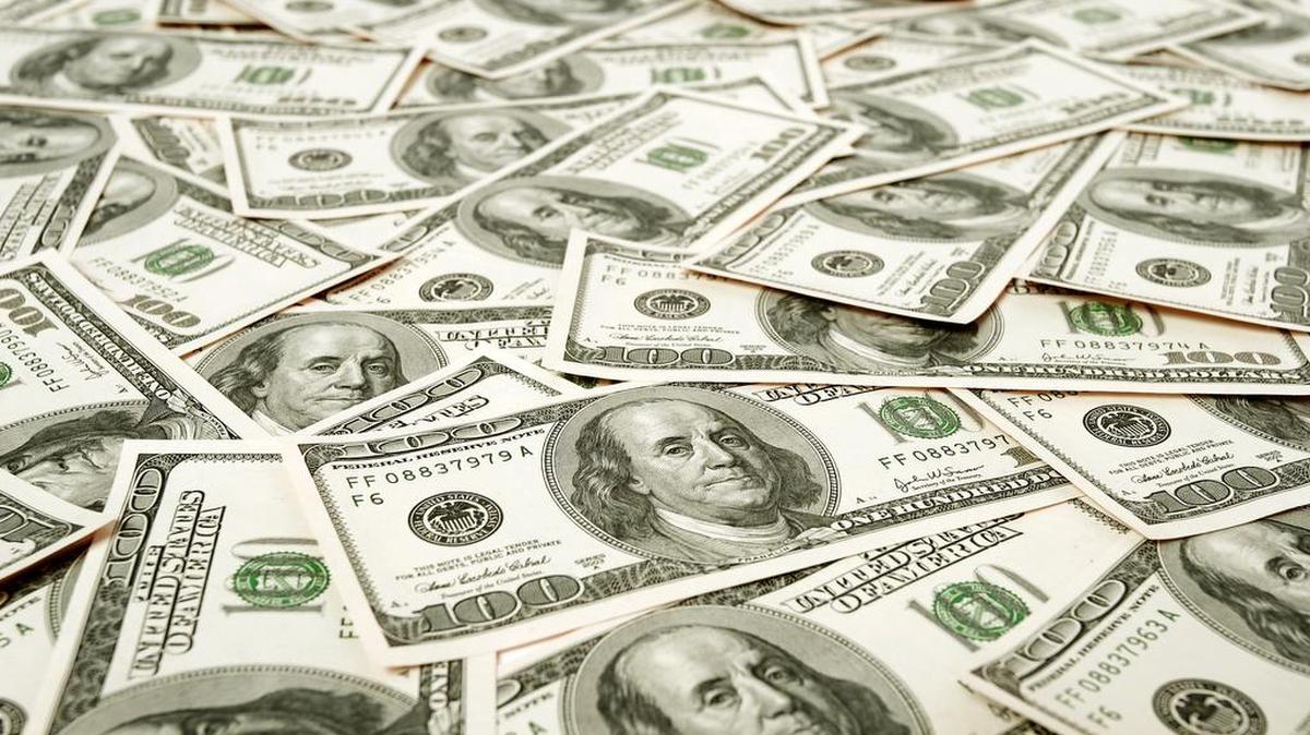 Lot’s of $100 banknotes with low depth of field. Can be used as a background for your projects.