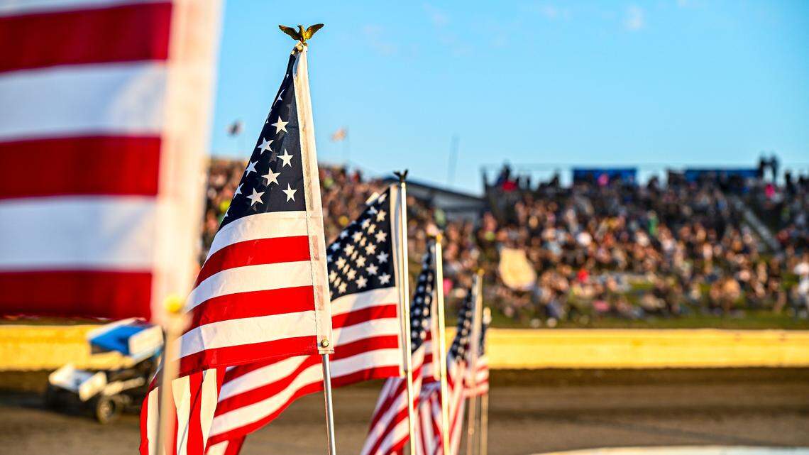 Robbie Price shows the way in front of packed Skagit Speedway house on fireworks night