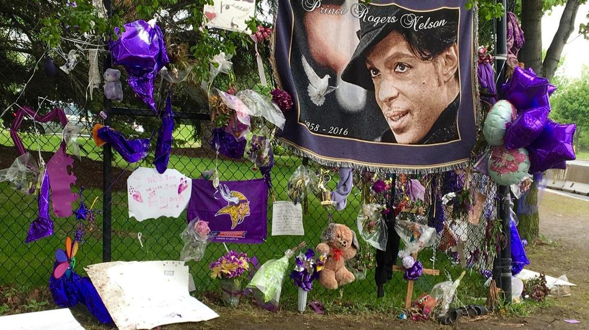 Items left by fans at a memorial for musician Prince hang from a fence outside Paisley Park, on Wednesday, May 11, 2016, in Chanhassen, Minn. Prince’s death was the result of an overdose of opioids, The Associated Press reported on Thursday, June 2, citing a law enforcement official.