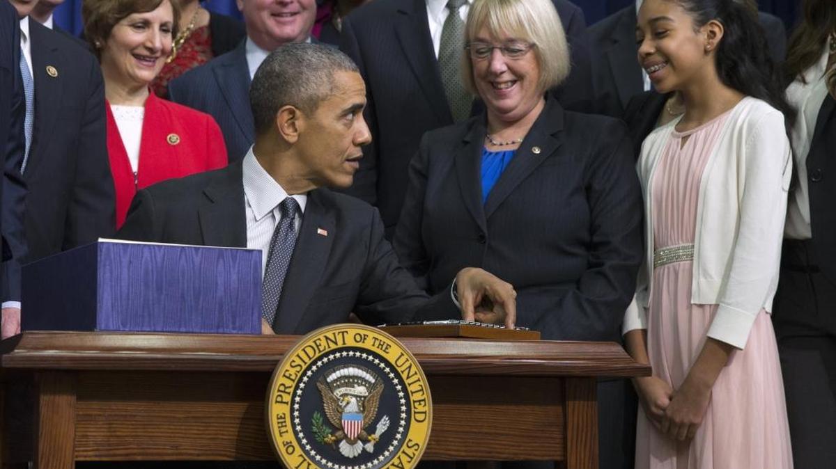 Sen. Patty Murray, D-Wash., ranking member on the Senate Health, Education, Labor and Pensions Committee, watches as President Barack Obama talks with student as he signs the “Every Student Succeeds Act,” a major education law setting U.S. public schools on a new course of accountability, Dec. 10, 2015, in Washington, D.C. The law will change the way teachers are evaluated and how the poorest performing schools are pushed to improve.