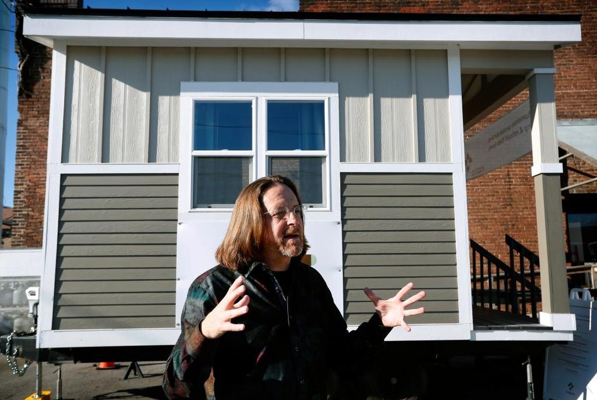 Joe Stevens, in front of one of the tiny homes his group has built in Des Moines, Iowa, is overwhelmed by the intense, sometimes tearful support he receives from churches, schools and service groups for his plan to use the trendy little structures to help homeless people.