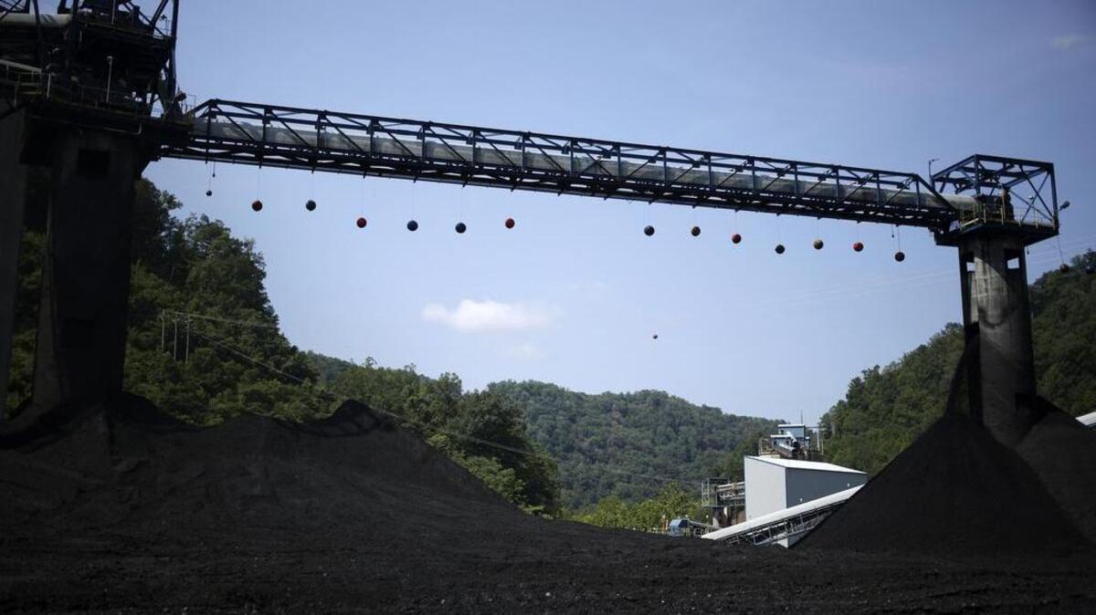 Mounds of coal sit beneath conveyor belts at an Alpha Natural Resources coal preparation plant in Logan County near Yolyn, West Virginia, U.S., in 2015, when the company filed for bankruptcy.
