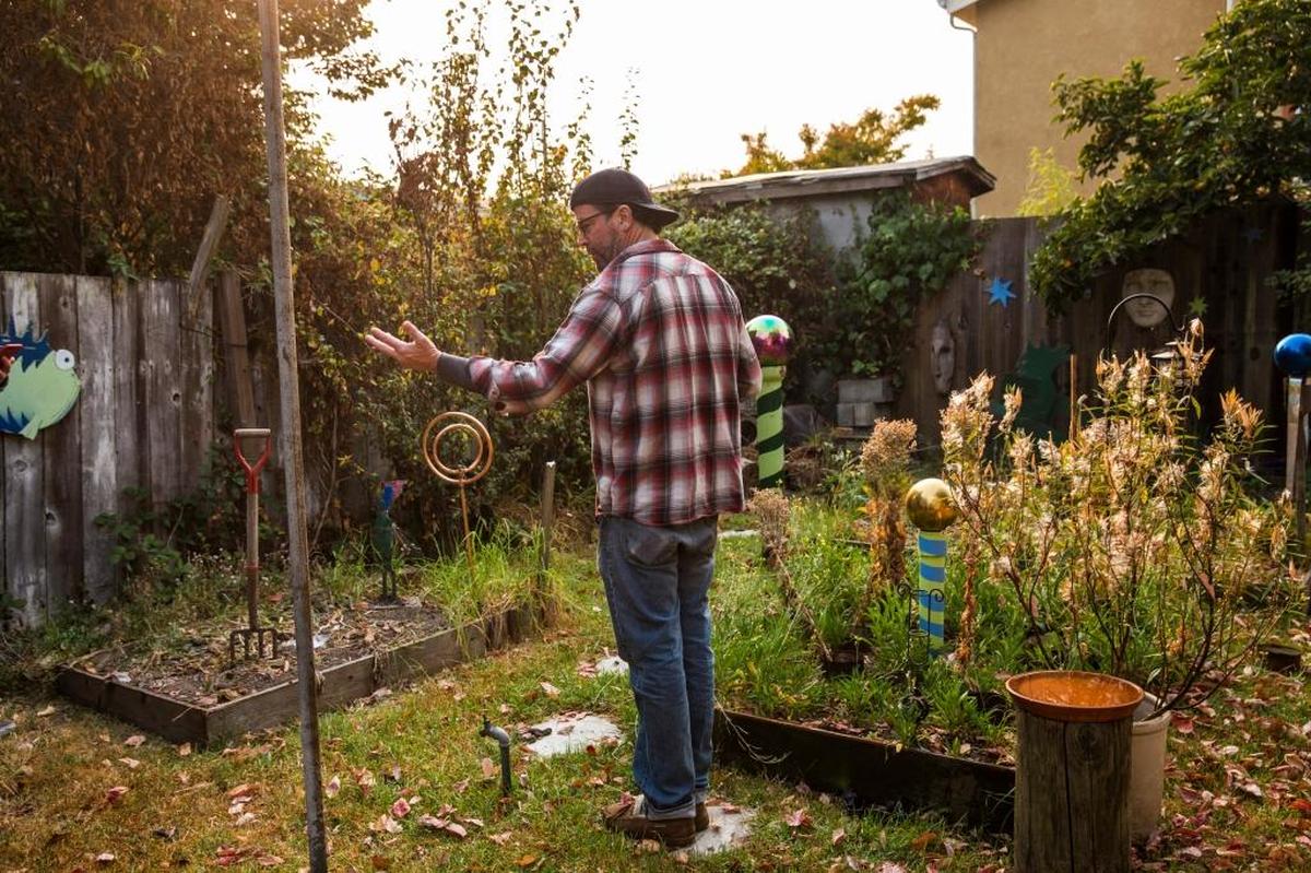 Kurt Caudle, who opposed a developer building three units on the single plot of land next to his house, in his backyard in Berkeley, Calif., Oct. 11, 2017. Caudle worries that denser development on the adjoining lot could obstruct sunlight for his garden.