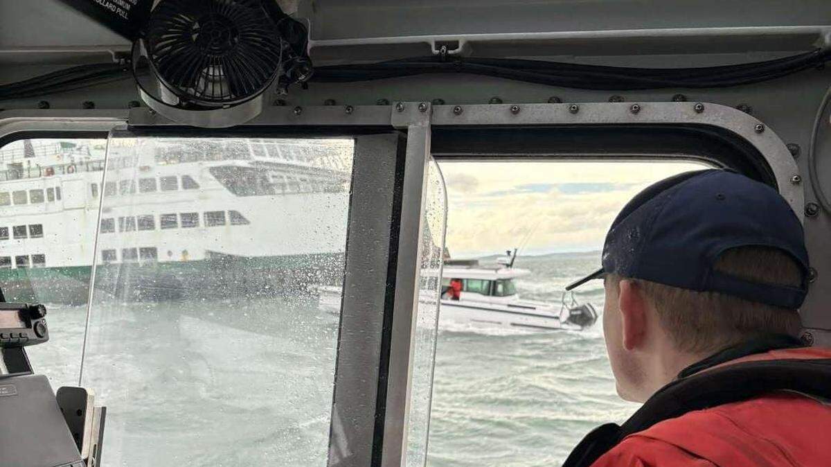 Six people and two dogs were rescued from a boat in Rosario Strait on March 9, the U.S. Coast Guard said.