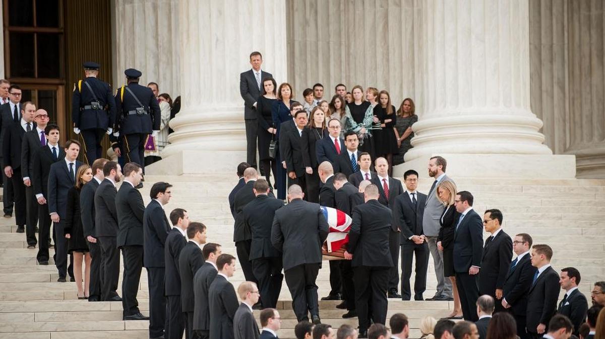 Staff line the steps of the Supreme Court as the casket of Justice Antonin Scalia is carried up on Friday, Feb. 19.