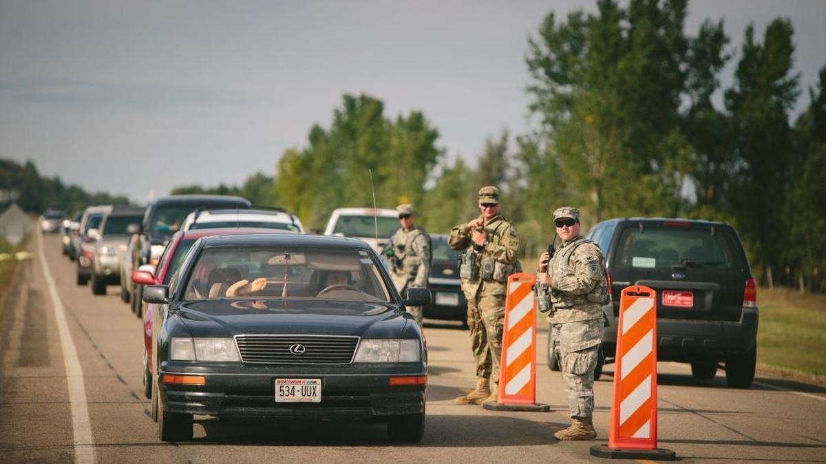 The North Dakota National Guard directs traffic in Morton County, where thousands of Native Americans have joined the Standing Rock Sioux tribe’s protest against an oil pipeline, in Bismarck, N.D., Sept. 6, 2016. Ranchers and residents in the conservative, overwhelmingly white countryside view the demonstrations with a mix of frustration and fear, reflecting the deep cultural divides and racial attitudes.