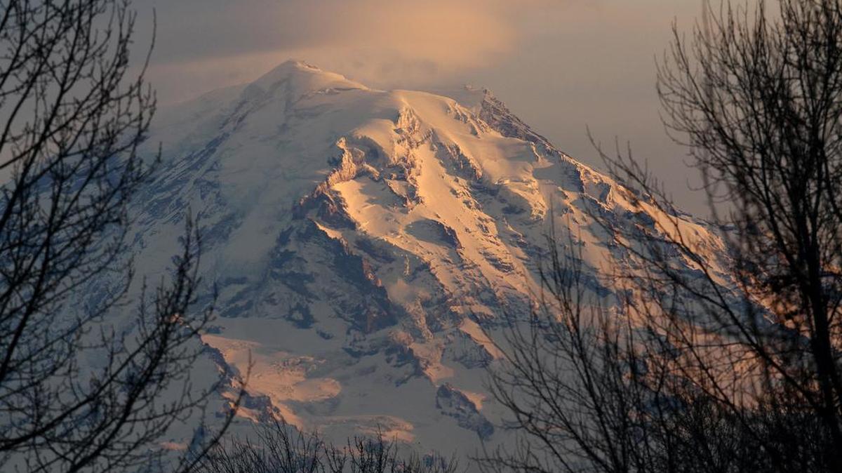 Mount Rainier at dusk. The beloved Northwest national park has a nearly $300 million maintenance backlog.