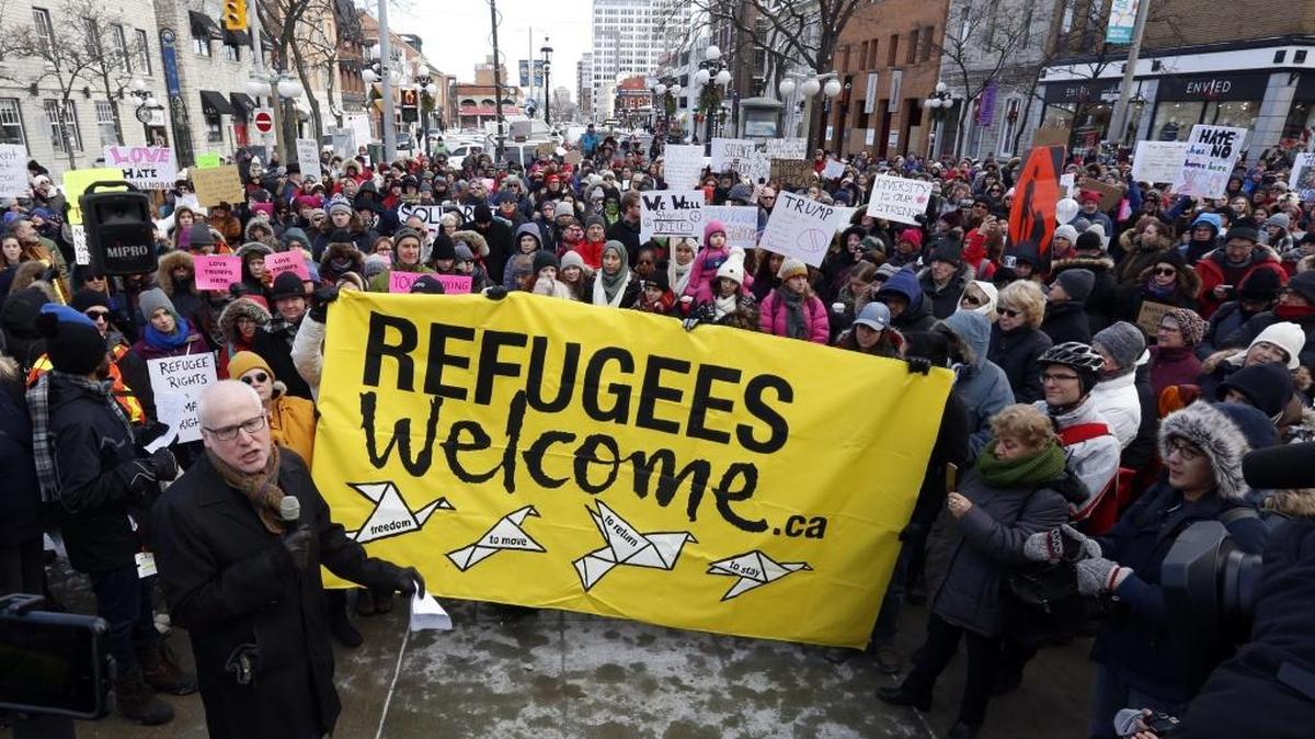 Thousands of people protest against the U.S. immigration policy of U.S. President Donald Trump, at the United States embassy in Ottawa, Monday, Jan. 30, 2017. 