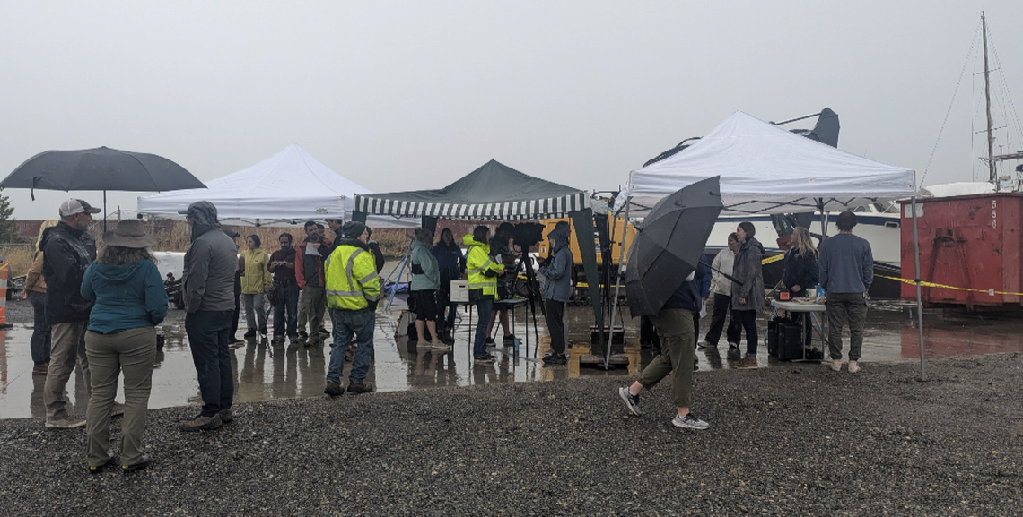 A crowd gathered to watch as a boat was dismantled Aug. 6.