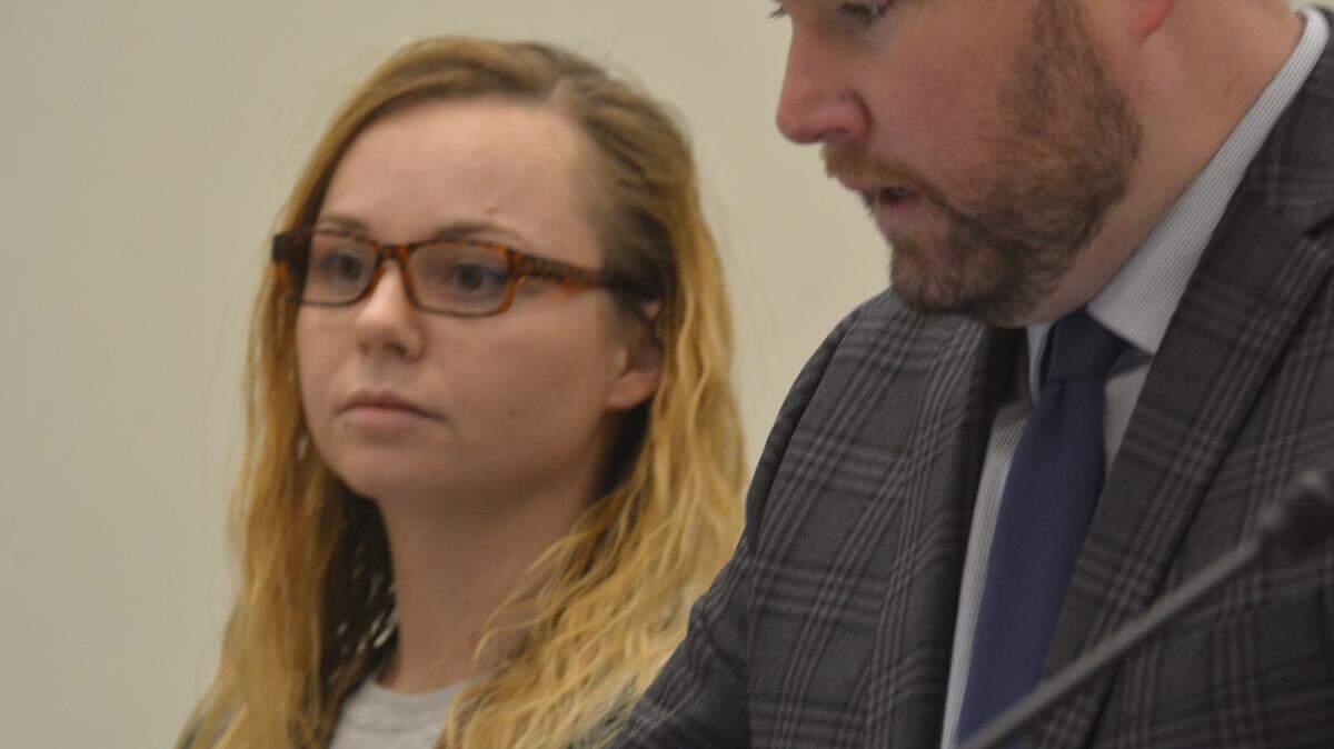 Victoria Rose Coe, 29, of Bellingham, stands with her lawyer, public defender Kurt Parrish, in a Whatcom County courtroom on Thursday.
